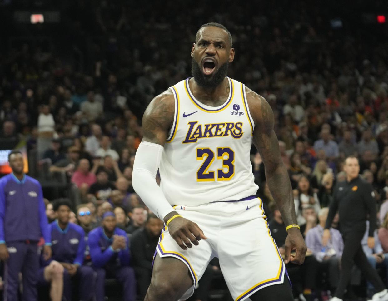 Los Angeles Lakers forward LeBron James (23) reacts after a dunk against the Phoenix Suns during the third quarter at Footprint Center on Feb. 25, 2024.