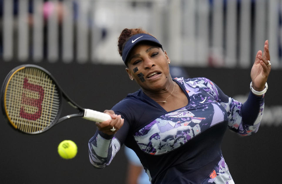 Serena Williams of the United States returns the ball during their doubles tennis match with Ons Jabeur of Tunisia against Marie Bouzkova of Czech Republic and Sara Sorribes Tormo of Spain at the Eastbourne International tennis tournament in Eastbourne, England, Tuesday, June 21, 2022. (AP Photo/Kirsty Wigglesworth)