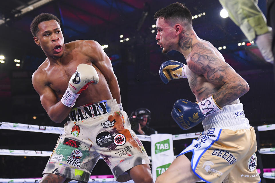 Devin Haney, left, of the United States fights in his bout against Australia's George Kambosos in their WBC lightweight title fight in Melbourne, Australia, Sunday, June 5, 2022. Haney retained his WBC lightweight title and added three more from the weight class with a unanimous points decision over Australian George Kambosos. (James Ross/AAPImage via AP)