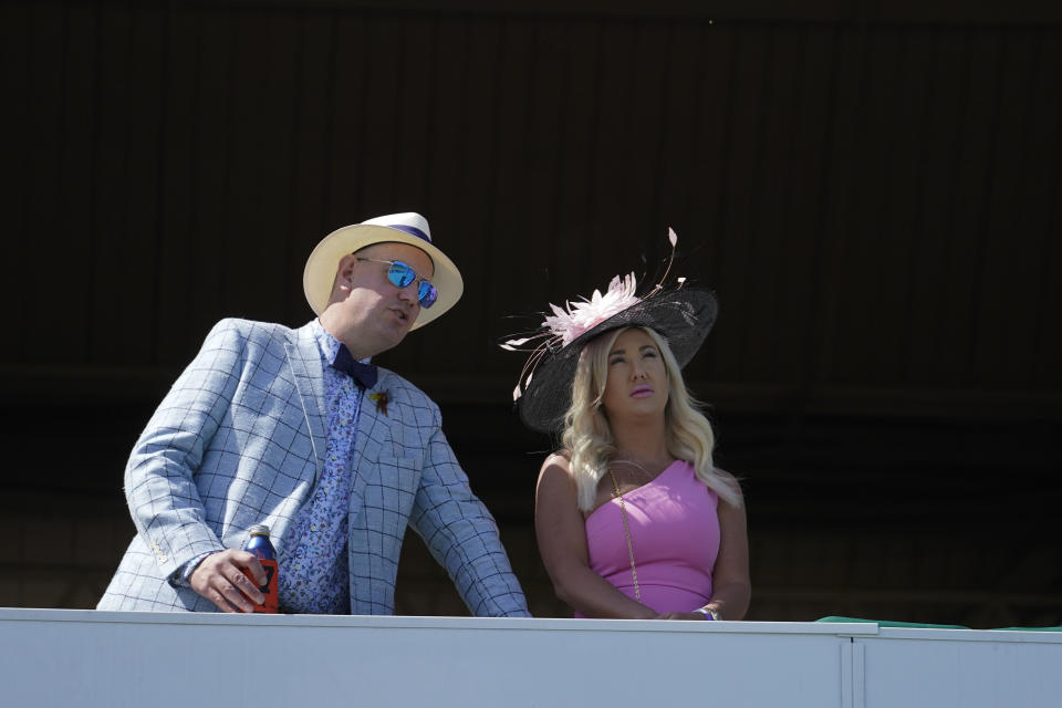 Fans watch a race before the 147th running of the Kentucky Derby at Churchill Downs, Saturday, May 1, 2021, in Louisville, Ky. (AP Photo/Brynn Anderson)