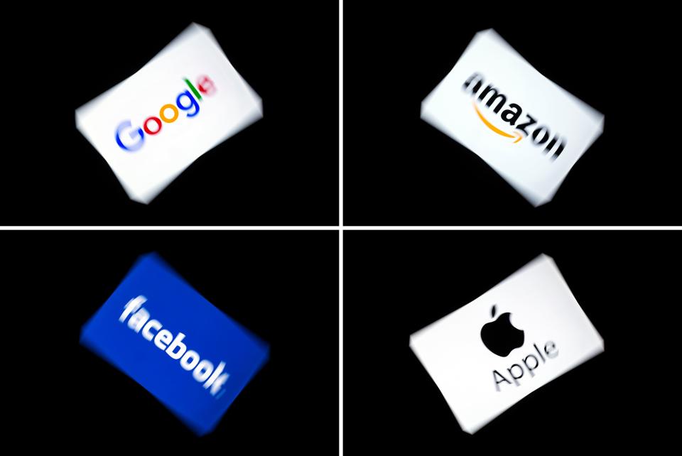 (COMBO) This combination of pictures shows the logos of the GAFA's, named after US  multinational technology and Internet-related services company Google, US online retail giant Amazon, US social media Facebook and US multinational technology company Apple, displayed on a tablet in Paris, on February 18, 2019. (Photo by Lionel BONAVENTURE / AFP)        (Photo credit should read LIONEL BONAVENTURE/AFP/Getty Images)