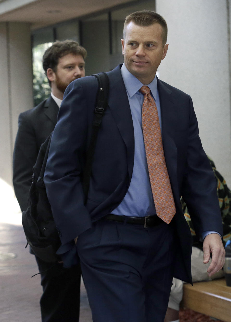 Samsung attorney David Nelson walks to a federal courthouse in San Jose, Calif., Tuesday, April 29, 2014. The Silicon Valley court battle between Apple and Samsung is entering its final phase. Lawyers for both companies are expected to deliver closing arguments Tuesday before jurors are sent behind closed doors to determine a verdict in a closely watched trial over the ownership of smartphone technology. (AP Photo/Jeff Chiu)