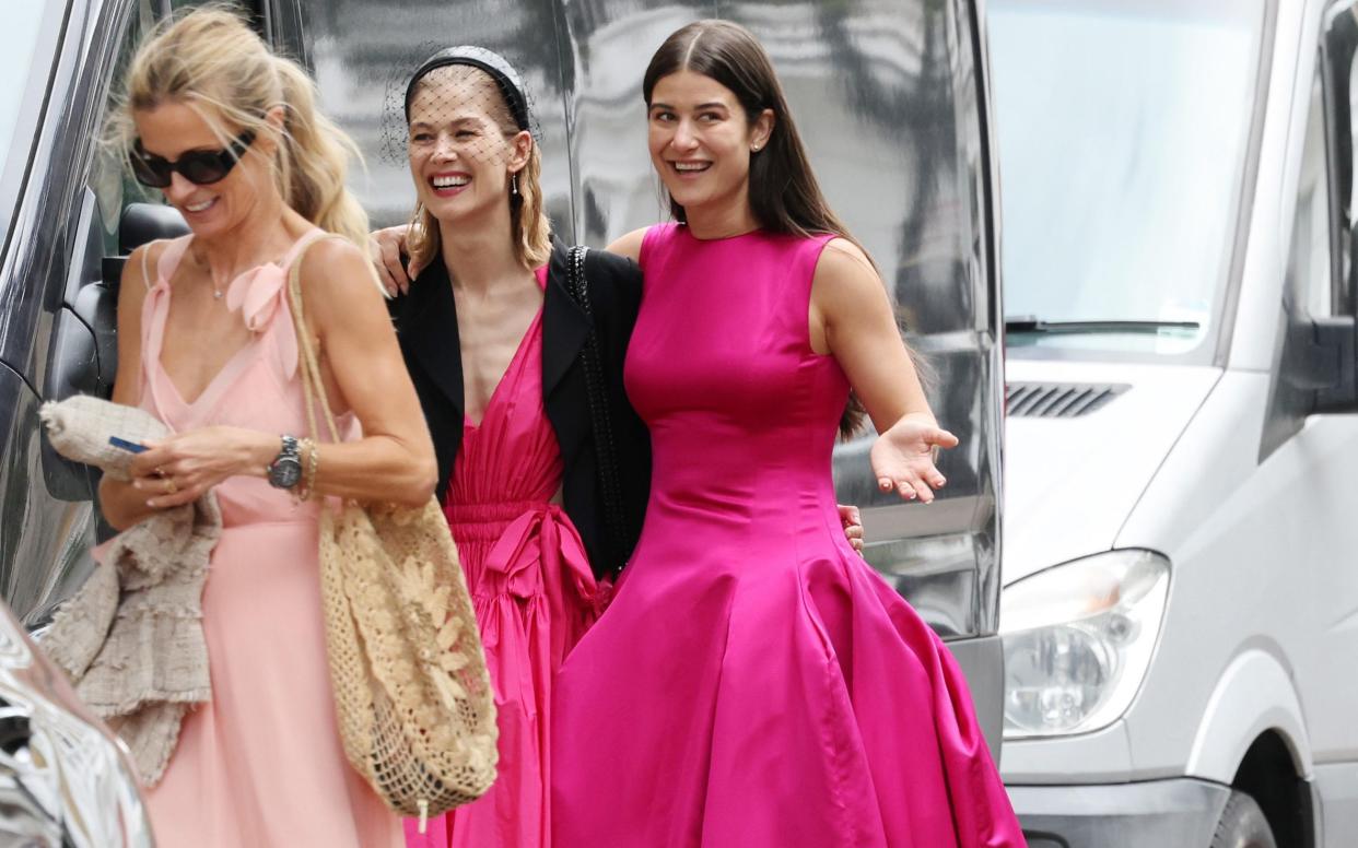 Actress Rosamund Pike (centre) at her stepdaughter Olive Uniacke’s (right) wedding - Dandef