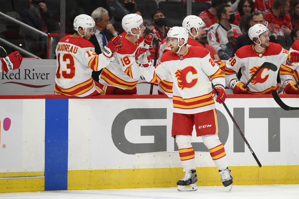 Calgary Flames center Elias Lindholm (28) celebrates his second goal of the first period of an NHL hockey game against the Washington Capitals, Saturday, Oct. 23, 2021, in Washington. (AP Photo/Nick Wass)