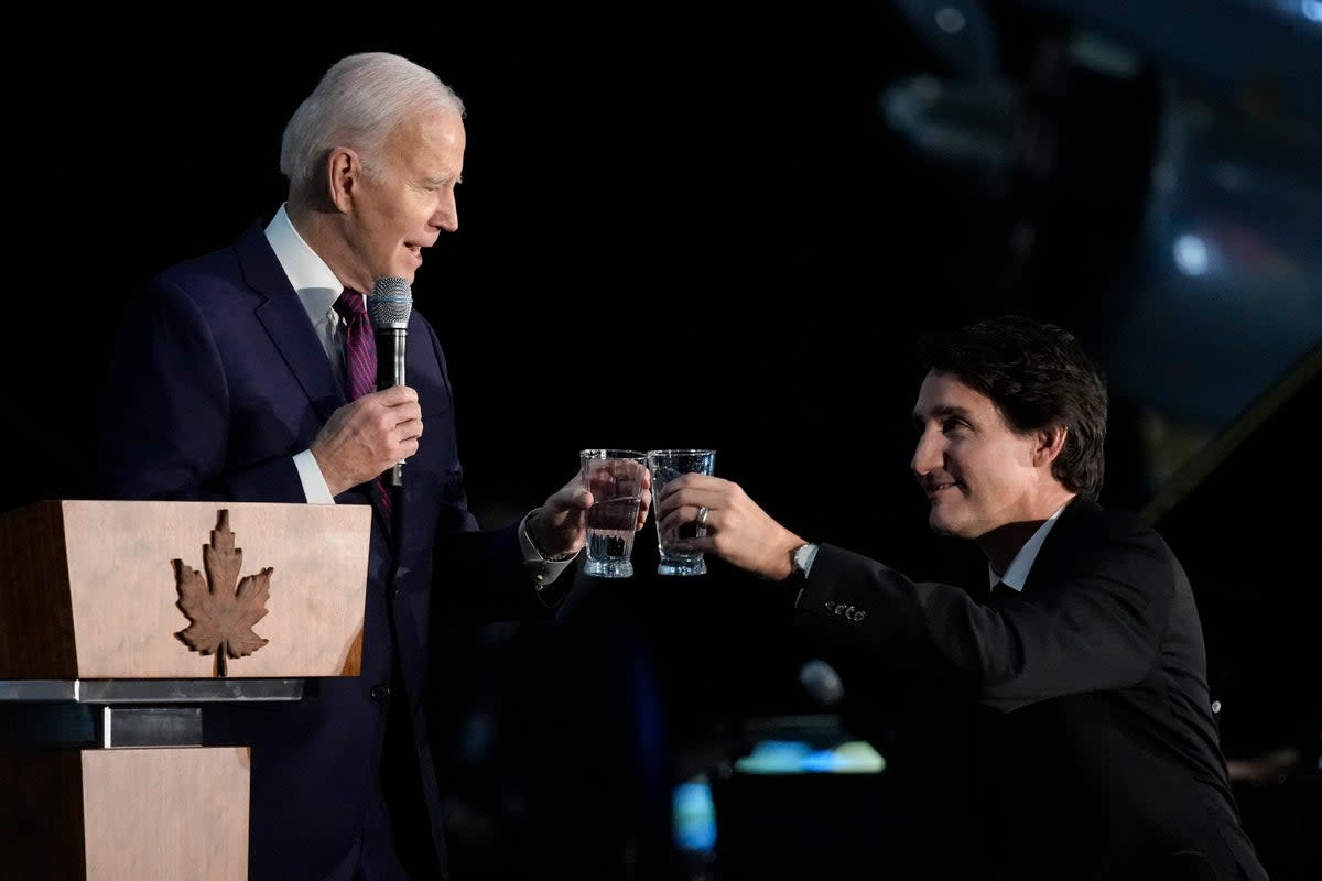 US president Joe Biden toasts with Canadian prime minister Justin Trudeau  (AP)