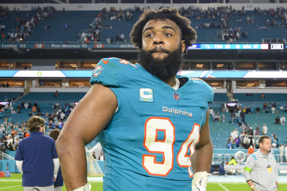 Miami Dolphins defensive tackle Christian Wilkins stands on the field after an NFL football game against the Tennessee Titans, Dec. 12, 2023, in Miami Gardens, Fla. Wilkins agreed to a four-year deal Monday, March 11, 2024 to sign with the Las Vegas Raiders. (AP Photo/Doug Murray)