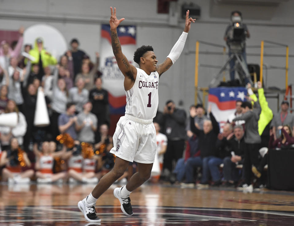 Colgate guard Jordan Burns celebrates a basket during the second half of an NCAA college basketball game against Bucknell for the championship of the Patriot League men's tournament in Hamilton, N.Y., Wednesday, March 13, 2019. Colgate won 94-80. (AP Photo/Adrian Kraus)