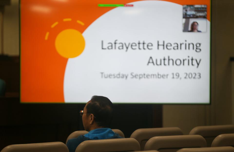 Lafayette-based landlord Chaofeng Liu waits as the City of Lafayette prepares to hold its Lafayette Hearing Authority meeting regarding two of Liu's properties, on Tuesday, Sept. 19, 2023, in Lafayette, Ind.