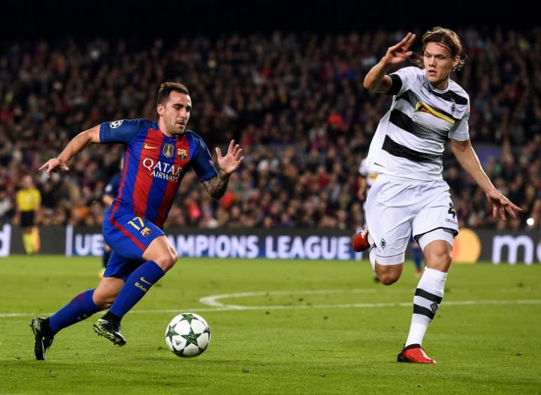 Barcelona's forward Paco Alcacer (L) vies with Moenchengladbach's defender Jannik Vestergaard during the UEFA Champions League Group C football match FC Barcelona vs Borussia Moenchengladbach on December 6, 2016