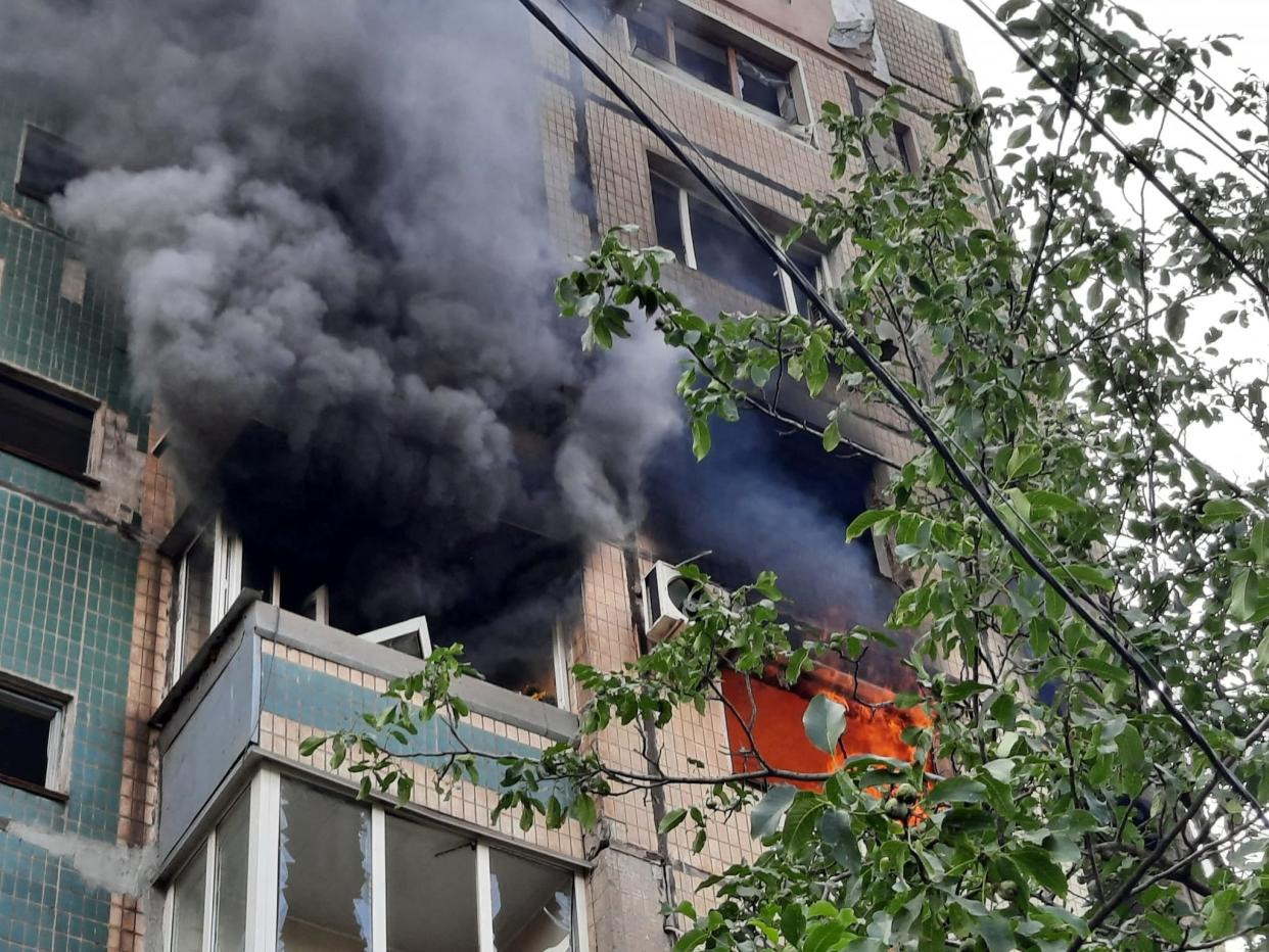 An apartment building burns after has been hit by a Russian missile strike, (via REUTERS)