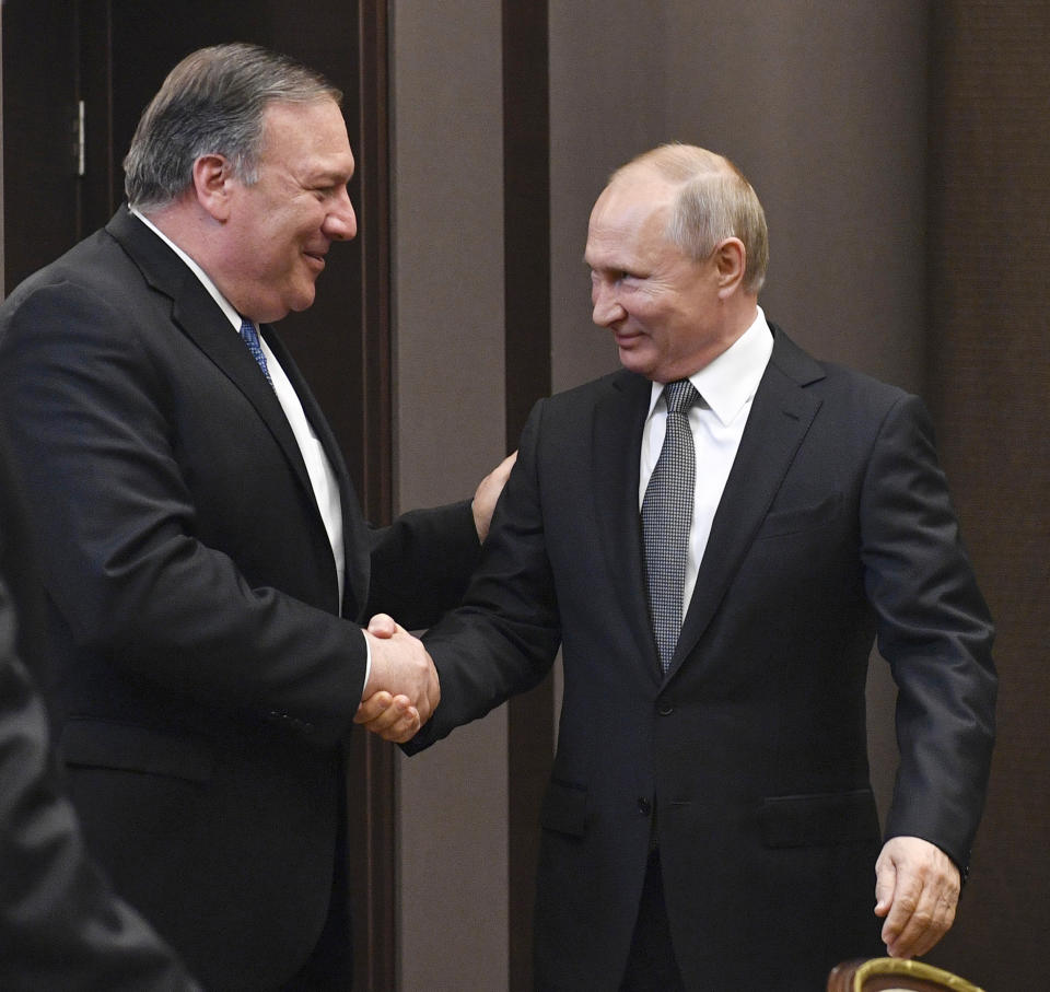 Russian President Vladimir Putin, right, and U.S. Secretary of State Mike Pompeo, greet each other prior to their talks in the Black Sea resort city of Sochi, southern Russia, Tuesday, May 14, 2019. Pompeo arrived in Russia for talks that are expected to focus on an array of issues including arms control and Iran. (Alexander Nemenov/Pool Photo via AP)