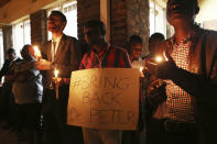 A night vigil prayer is held for a missing doctor, Peter Magombeyi, by well wishers and fellow doctors at Harare hospital in Zimbabwe Tuesday, Sept,17, 2019. The Zimbabwe Hospitals Association has said that that their president, Peter Magombeyi, was abducted on Saturday, days after receiving threats on his phone. Magombeyi had expressed concerns to journalists about the poor state of Zimbabwe,s hospitals.(AP Photo/Tsvangirayi Mukwazhi)