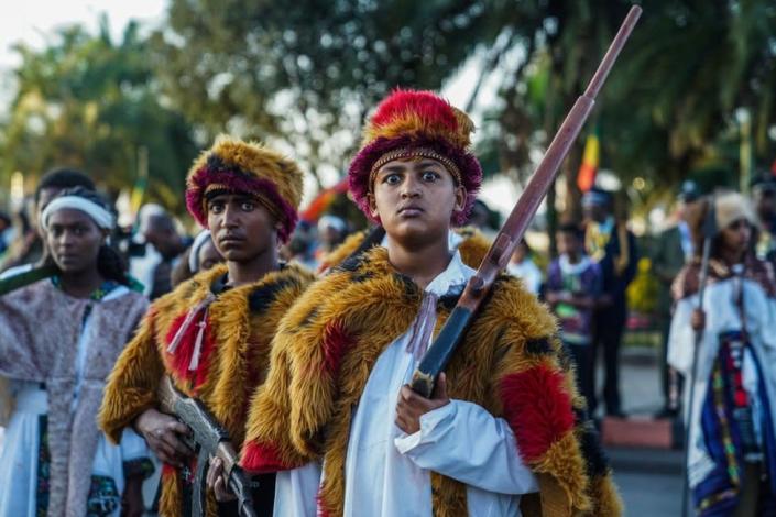 Youth pose during the commemoration of the 126th victory of Adwa, at Menelik square in Addis Ababa, Ethiopia, on March 02, 2022. - The Battle of Adwa was the climactic battle of the First Italo-Ethiopian War. The Ethiopian forces defeated the Italian invading force on March 1, 1896, near the town of Adwa. The decisive victory thwarted the campaign of the Kingdom of Italy to expand its colonial empire in the Horn of Africa.