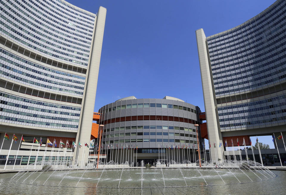 FILE - In this June 18, 2014, file photo flags fly outside the United Nations building in Vienna, Austria. An internal confidential document from the United Nations, leaked to The New Humanitarian and seen by The Associated Press, says that dozens of servers were “compromised” at offices in Geneva and Vienna. (AP Photo/Ronald Zak, File)