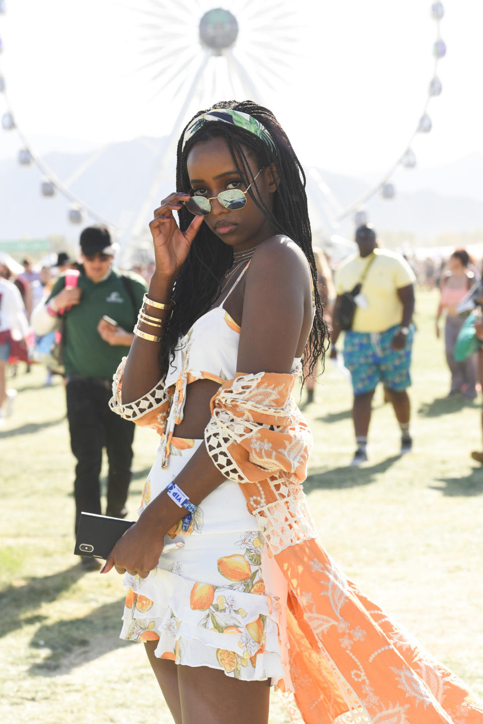 This woman embraced the sunny desert vibes wearing a lemon-printed set with an orange kimono