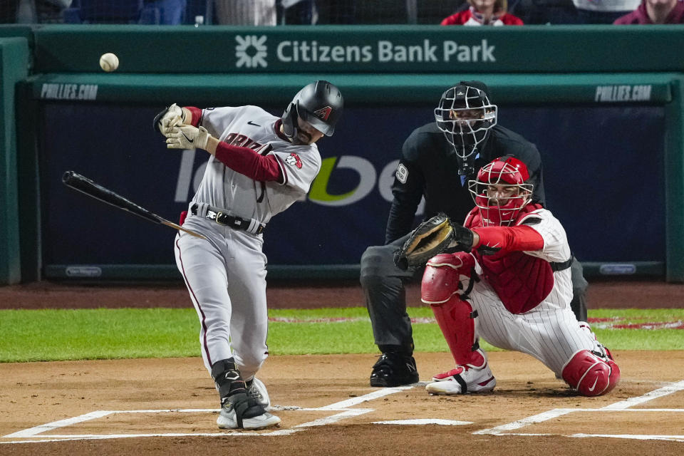 Arizona Diamondbacks' Corbin Carroll hits a broken bat single against the Philadelphia Phillies during the first inning in Game 1 of the baseball NL Championship Series in Philadelphia, Monday, Oct. 16, 2023. (AP Photo/Matt Rourke)