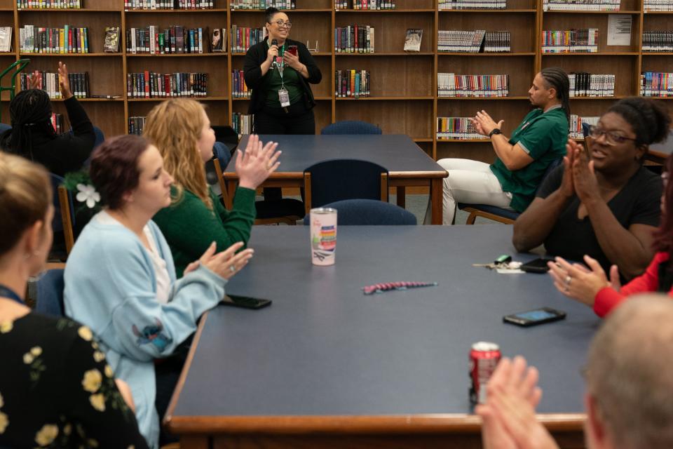 Highland Park High School principal Juli Watson shares the news of her school exceeding 90% graduation rate with staff during a Tuesday meeting in the media center.