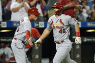 St. Louis Cardinals' Paul Goldschmidt, right, celebrates with third base coach Ron "Pop" Warner as he runs the bases after hitting a home run during the fifth inning of a baseball game against the New York Mets, Monday, Sept. 13, 2021, in New York. (AP Photo/Frank Franklin II)