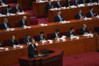 Zhao Leji, chairman of the NPC Standing Committee, delivers a speech during the second plenary session of the National People's Congress (NPC) in Beijing, Friday, March 8, 2024. (AP Photo/Andy Wong)