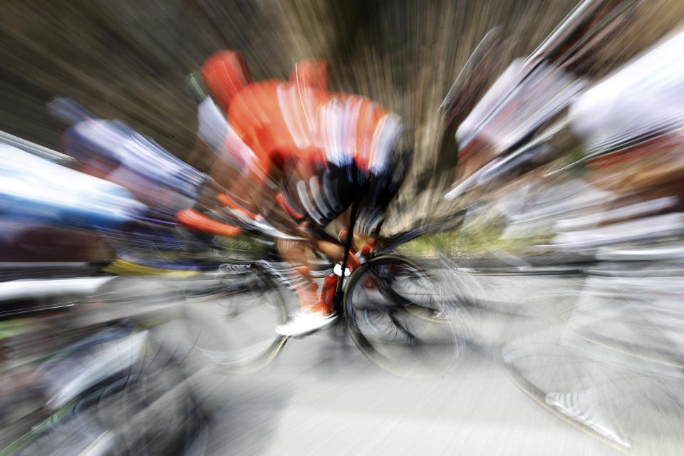 In this slow motion picture a rider pedals in the pack during the tenth stage of the Tour de France cycling race over 217 kilometers (135 miles) with start in Saint-Flour and finish in Albi, France, Monday, July 15, 2019. (AP Photo/ Christophe Ena)