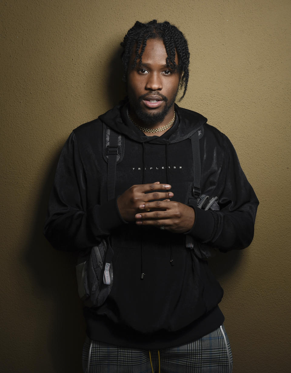 In this Nov. 30, 2018 photo, Shameik Moore, a cast member in "Spider-man: Into the Spider-Verse," poses for a portrait at the Four Seasons Hotel in Los Angeles. (Photo by Chris Pizzello/Invision/AP)