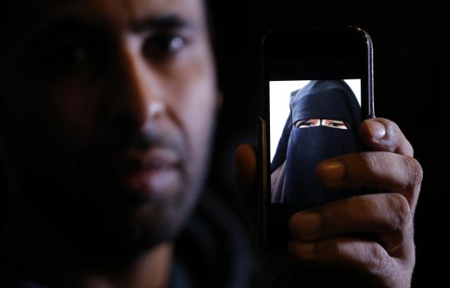 Foad, the brother of 15 year-old Nora who left her home in Avignon for Syria nine months ago, shows a portrait he took last September on his cell phone as he attends an interview with Reuters in Paris, October 6, 2014. Foad, a French truck driver of Moroccan origin, travelled alone through war-torn Syria to rescue his 15-year-old sister from an Islamist group she said was holding her captive. But when they finally stood face to face, in tears, she would not leave. Foad is convinced that his sister Nora, whom he described as an impressionable teen who loved Disney movies before leaving for Syria one afternoon in January, stayed on because she was threatened with execution by the French-speaking commander, or emir, of the group she joined. The former high school student is among dozens of European girls, many of them her age, living with such groups in Syria - an aspect of the conflict that is beginning to worry European governments previously more focused on the flow of young men to join the ranks of Islamic state and other armed militias. Picture taken October 6, 2014. REUTERS/Christian Hartmann (FRANCE - Tags: POLITICS CONFLICT TPX IMAGES OF THE DAY)