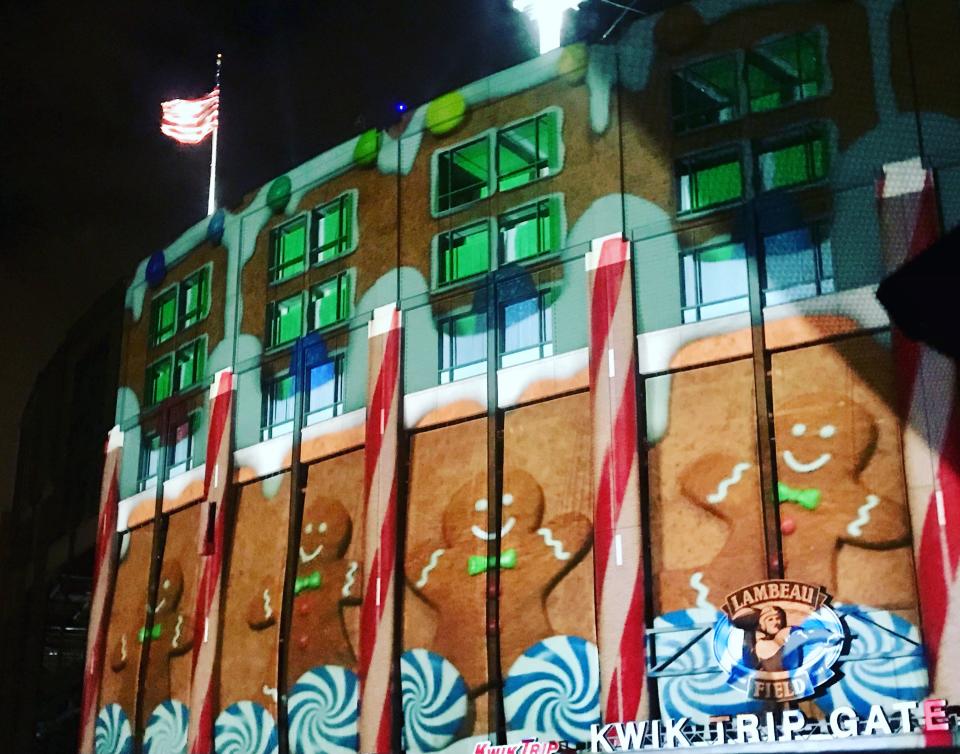 The free Winter Jubilee Light Show is projected on the exterior of Lambeau Field.