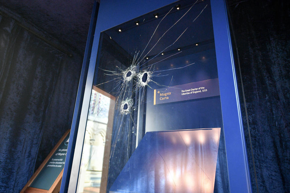 Hammer holes in the glass case that houses the Magna Carta, inside the Chapter House, at Salisbury Cathedral after a 45-year-old man has been arrested on suspicion of its attempted theft.