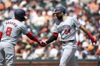 Washington Nationals first baseman Joey Gallo (24) is congratulated by Eddie Rosario (8) after hitting a home run against the San Francisco Giants during the second inning of a baseball game in San Francisco, Wednesday, April 10, 2024. (AP Photo/Jed Jacobsohn)