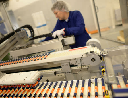 FILE PHOTO: A Novo Nordisk employee controls a machine at an insulin production line in a plant in Kalundborg, Denmark November 4, 2013. REUTERS/Fabian Bimmer/File Photo