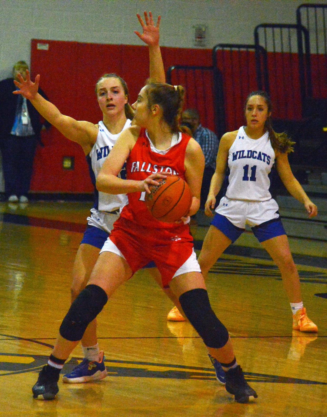 Williamsport's Emily Moser applies pressure to a Fallston ball handler.