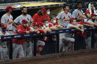 St. Louis Cardinals watch from the dugout during the ninth inning of Game 3 of the team's National League wild-card baseball series against the San Diego Padres, Friday, Oct. 2, 2020, in San Diego. The Padres won 4-0, and eliminated the Cardinals from the playoffs. (AP Photo/Gregory Bull)