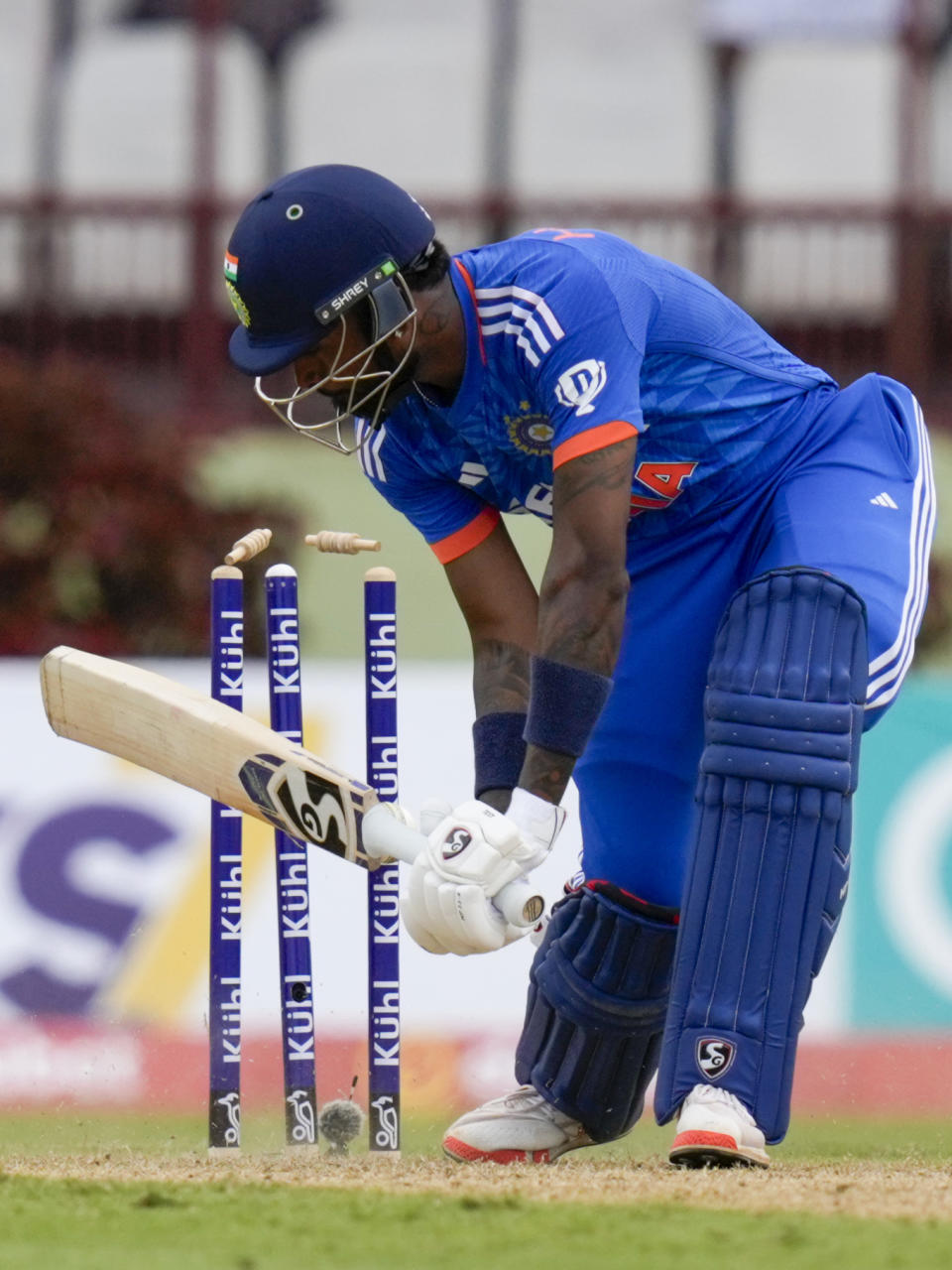 India's captain Hardik Pandya is bowled by West Indies' Alzarri Joseph during their second T20 cricket match at Providence Stadium in Georgetown, Guyana, Sunday, Aug. 6, 2023. (AP Photo/Ramon Espinosa)