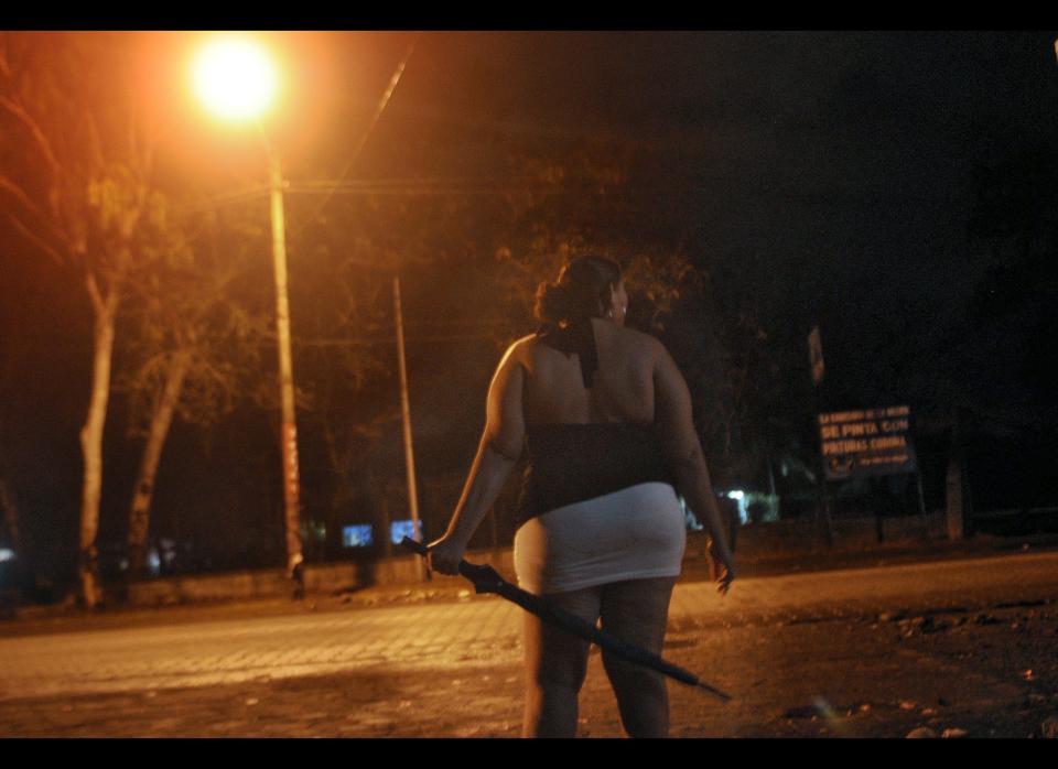 Wendy, a Nicaraguan sex worker and member of NGO Girasoles Nicaragua (Nicaragua Sunflowers), waits for clients on a street in Managua on April 18, 2012. (Photo credit: Elmer Martinez/AFP/Getty Images)