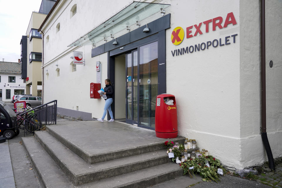 A woman leaves the grocery store Coop Extra on the day it reopened after a bow and arrow attack last Wednesday, in Kongsberg, Norway, Monday, Oct. 18, 2021. Norway has announced it will hold an independent investigation into the actions of police and security agencies following a bow-and-arrow attack that killed five people and injured three others. Police have been criticized for reacting too slowly to contain the massacre. Police have acknowledged that the five deaths Wednesday night in the town of Kongsberg took place after police first encountered the armed suspect. (Terje Bendiksby/NTB via AP)