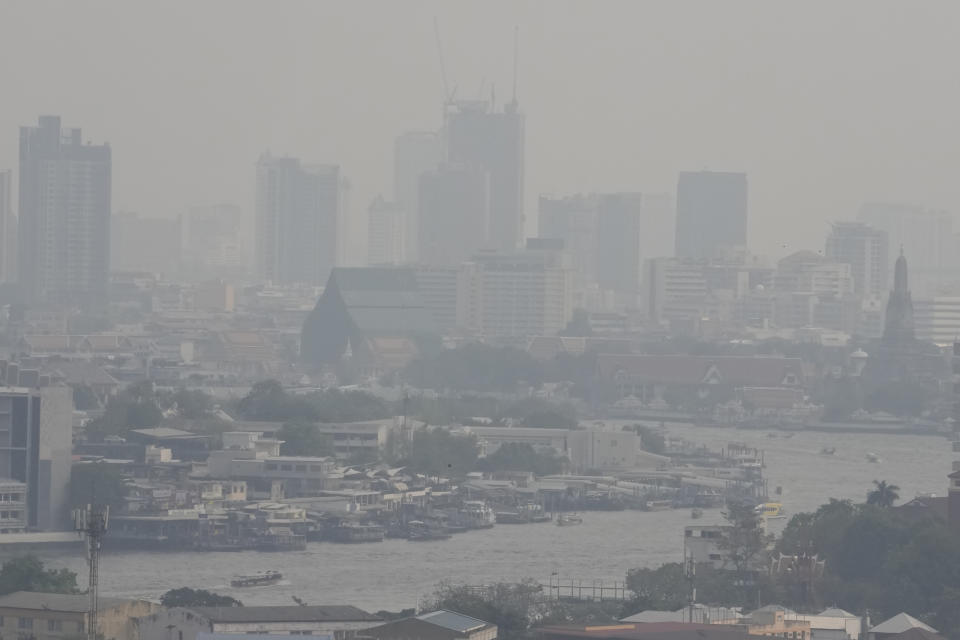 A thick layer of smog covers central in Bangkok, Thailand, Thursday, Feb. 15, 2024. City officials in Thailand’s capital Bangkok were ordered Thursday to work from home for two days, and workers in the private sector were encouraged to do likewise as air pollution soared to unhealthy levels. (AP Photo/Sakchai Lalit)