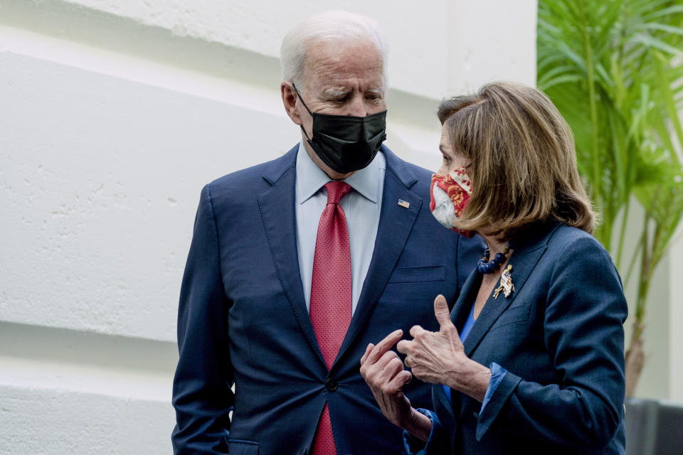 President Joe Biden and House Speaker Nancy Pelosi of Calif., speak together as they depart after a House Democratic Caucus meeting on Capitol Hill, Friday, Oct. 1, 2021, in Washington. (AP Photo/Alex Brandon)