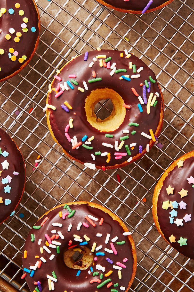 <p>Who doesn't love a good donut? This baked variety is just as satisfying as the fried version, but SO much lighter. We can't resist a good chocolate glaze, but these would also be delicious rolled in cinnamon sugar, <a href="https://www.delish.com/uk/cooking/recipes/a29733984/easy-churros-recipe/" rel="nofollow noopener" target="_blank" data-ylk="slk:churro;elm:context_link;itc:0;sec:content-canvas" class="link ">churro</a>-style. </p><p>Get the <a href="https://www.delish.com/uk/cooking/recipes/a33430243/baked-donuts-recipe/" rel="nofollow noopener" target="_blank" data-ylk="slk:Baked Donuts;elm:context_link;itc:0;sec:content-canvas" class="link ">Baked Donuts</a> recipe.</p>