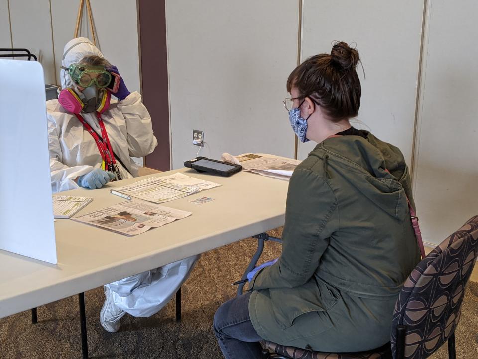 Elections Chief Inspector Mary Magdalen Moser runs a polling location in Kenosha, Wisconsin, in full hazmat gear as the Wisconsin primary kicks off despite the coronavirus pandemics on April 7, 2020. - Voters in Wisconsin began casting ballots Tuesday in a controversial presidential primary held despite a state-wide, stay-at-home order and concern that the election could expose thousands of voters and poll workers to the coronavirus. Democratic officials had sought to postpone the election but were overruled by the top state court, and the US Supreme Court stepped in to bar an extension of voting by mail that would have allowed more people to cast ballots without going to polling stations. Both courts have conservative majorities. (Photo by Derek R. HENKLE / AFP) (Photo by DEREK R. HENKLE/AFP via Getty Images)