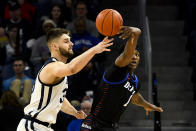 DePaul forward Romeo Weems (1) tips the ball away rom Butler forward Bryce Golden (33) during the first half of an NCAA college basketball game Saturday, Jan. 18, 2020, in Chicago. (AP Photo/Matt Marton)