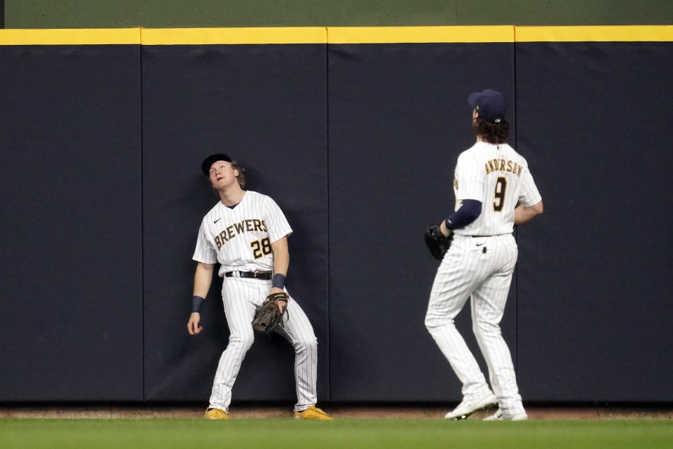 Milwaukee Brewers' Joey Wiemer (28) reacts after watching a solo home run hit by Los Angeles Angels' Shohei Ohtani during the third inning of a baseball game, Sunday, April 30, 2023, in Milwaukee. (AP Photo/Aaron Gash)