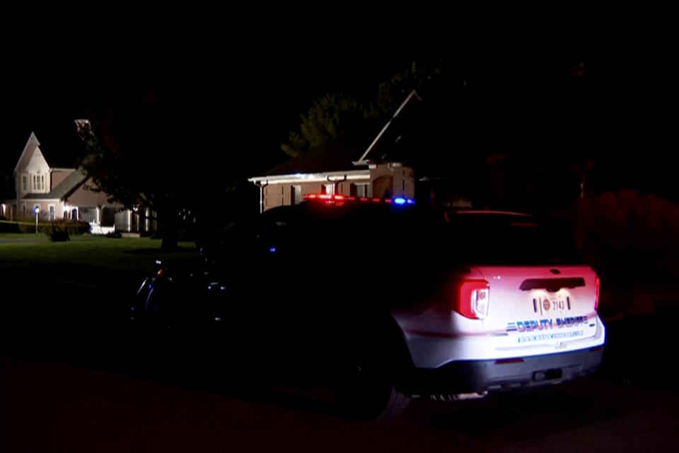 In this image made from a video provided by WJLA, a law enforcement vehicle is parked near the scene of a fatal shooting in Hagerstown, Md., Thursday, Oct. 19, 2023. Andrew Wilkinson, a Maryland circuit court judge, was fatally shot in the driveway of his home Thursday night, police said. (WJLA via AP)