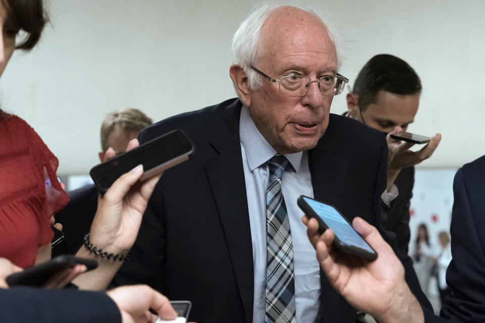 FILE - In this July 21, 2021 photo, Sen. Bernie Sanders, I-Vt., talks to reporters as he walks to the senate chamber ahead of a test vote scheduled by Democratic Leader Chuck Schumer of New York on the bipartisan infrastructure deal on Capitol Hill, in Washington. (AP Photo/Jose Luis Magana)