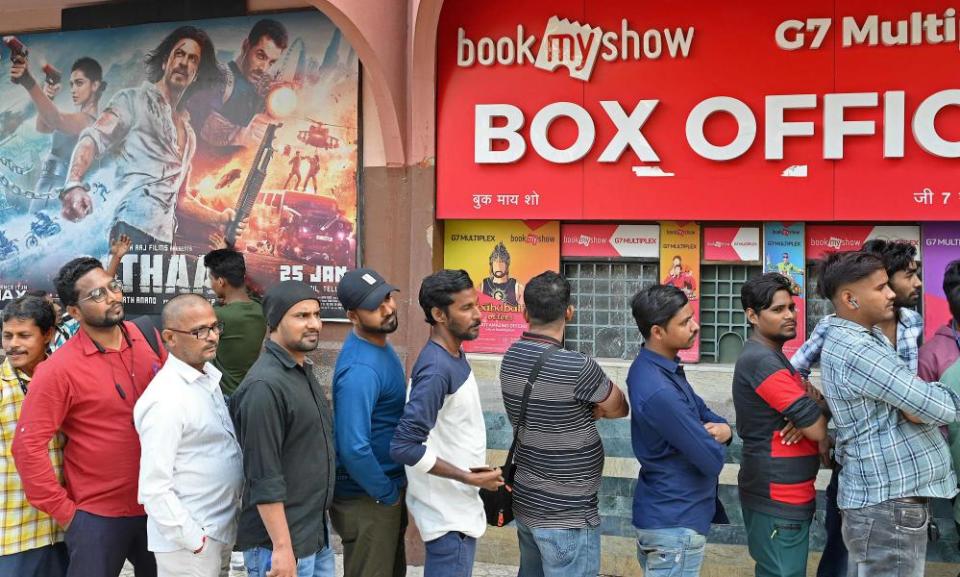 Moviegoers queue to watch Pathaan at a cinema hall in Mumbai.