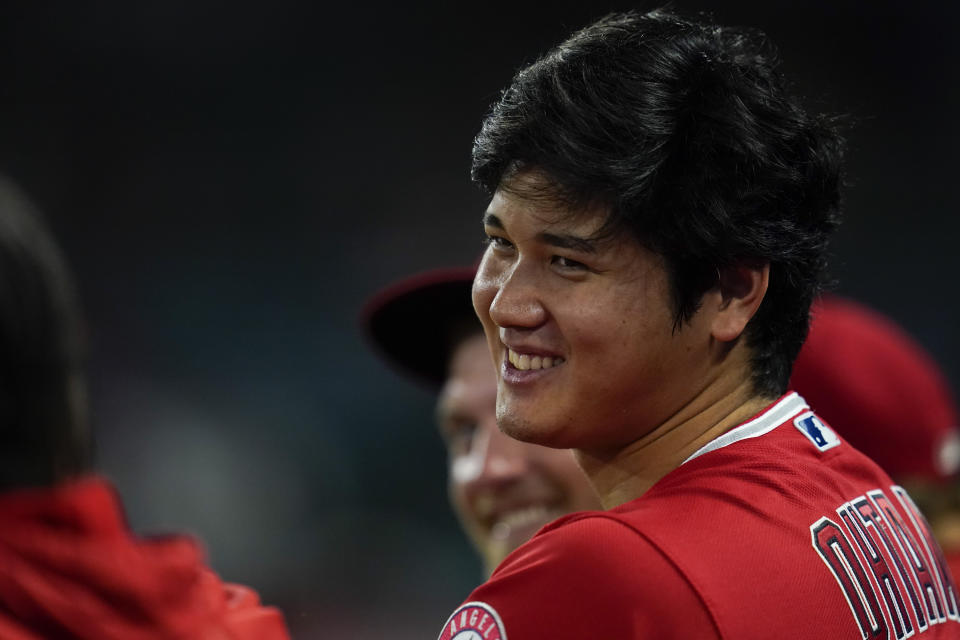 Los Angeles Angels designated hitter Shohei Ohtani (17) stands in the dugout during the tenth inning of a baseball game against the Detroit Tigers in Anaheim, Calif., Tuesday, Sept. 6, 2022. (AP Photo/Ashley Landis)