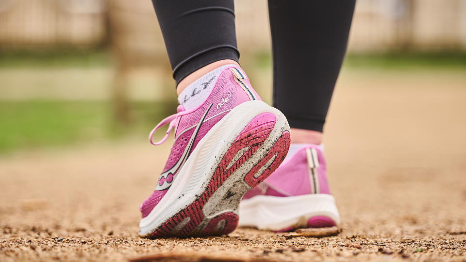 Woman wearing Saucony Ride 17 running shoes