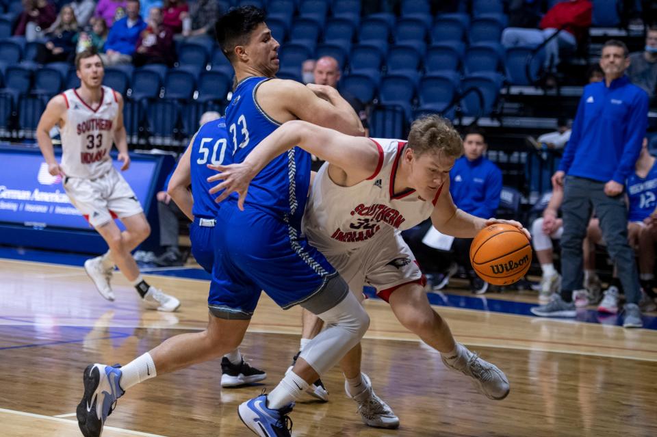 Rockhurst's Rich Byhre (33) defends in a game against Southern Indiana in 2022. This past season, Byhre led Rockhurst in scoring (17.9 ppg), rebounding (8.1 rpg), blocks (22), minutes (33 mpg) and shooting percentage (50.5%).