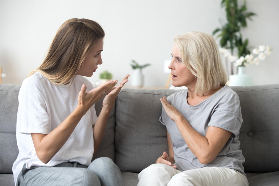 Angry young woman has disagreement with annoyed old mother in law, grown daughter arguing fighting quarreling with senior elderly mom, different age generations bad relations family conflict concept