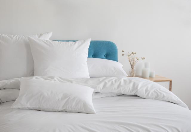 What Should You Do With Your Bed's Throw Pillows When You Sleep?