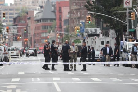 New York police close off West 16th Street near Seventh Avenue, as police said they were investigating suspicious packages in Manhattan
